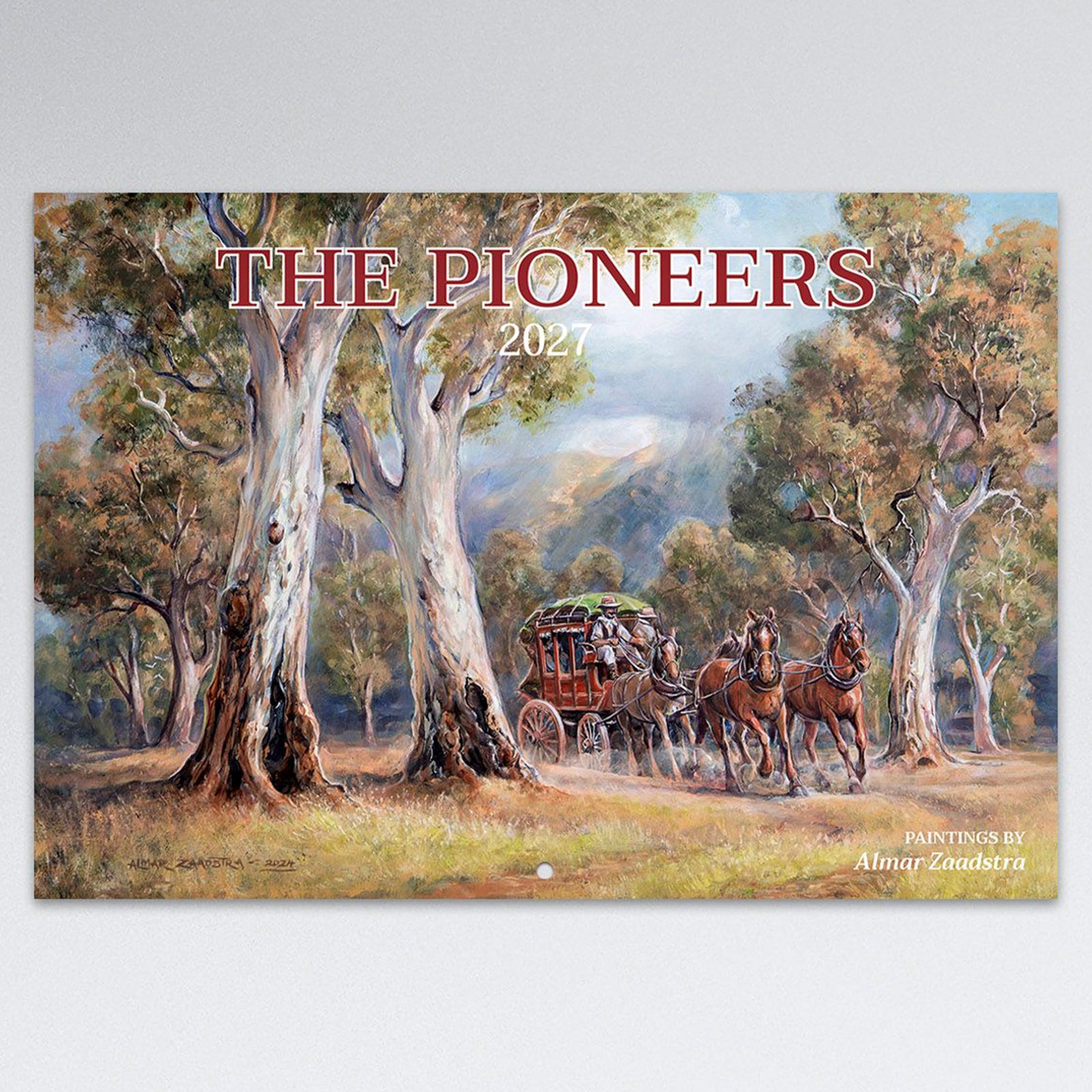 Front cover artwork of the Easy2C 2027 The Pioneers stitched calendar featuring a horse drawn stagecoach travelling through an Australian bush landscape painted by Almar Zaadstra.