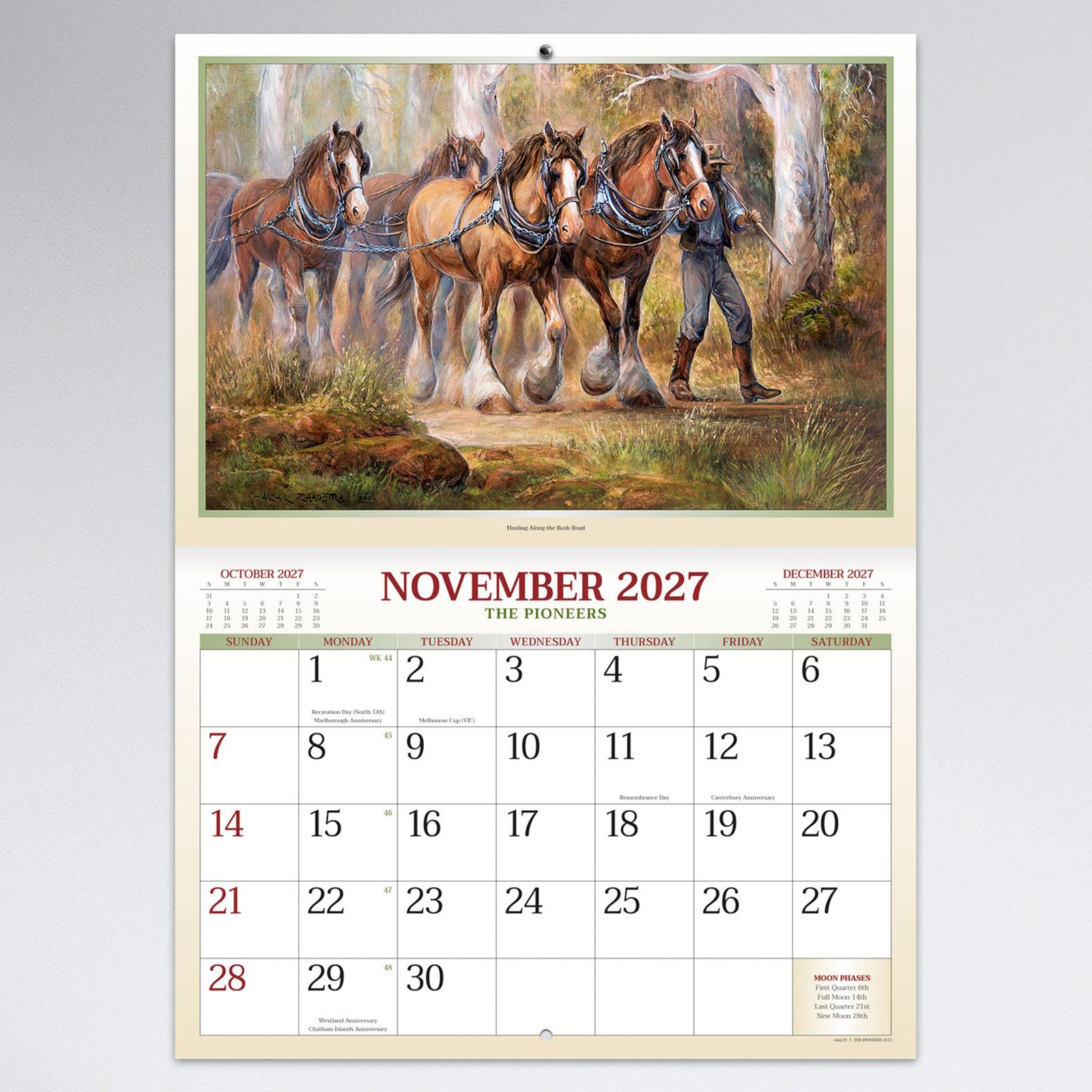 November calendar page featuring a detailed painting of working horses travelling through the Australian bush with a spacious monthly planning grid below.