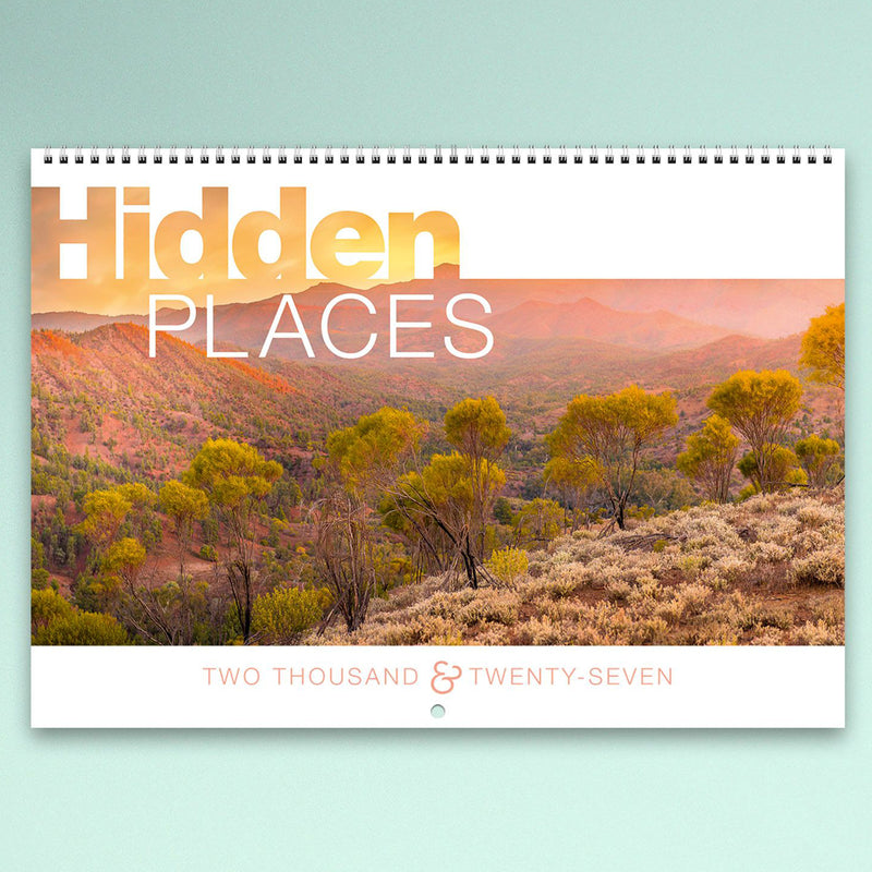 The front cover of the Easy2C Hidden Places 2027 calendar featuring an expansive Australian landscape under warm sunrise light. Premium wiro binding and clean modern cover design make it suitable for gifting or office display.