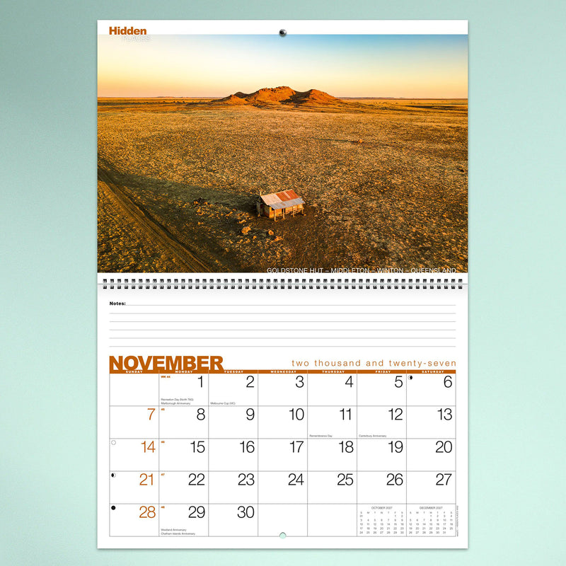 The November calendar page highlighting an expansive Queensland outback landscape with a remote hut surrounded by open plains. The monthly planner below offers large date boxes for organising appointments and reminders.