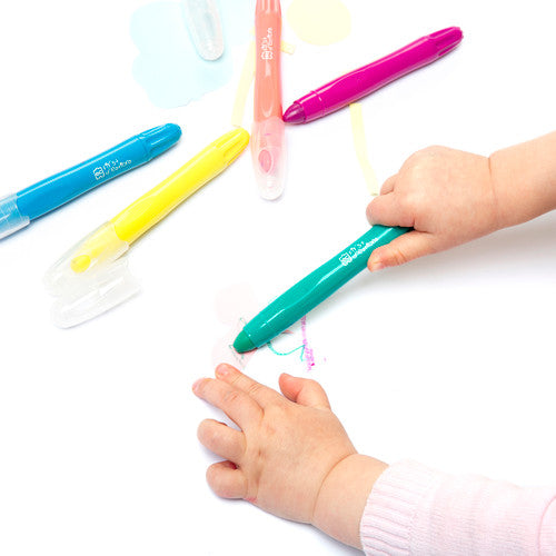 Child using Easi-Grip crayon with wet paintbrush to create watercolour effect on paper