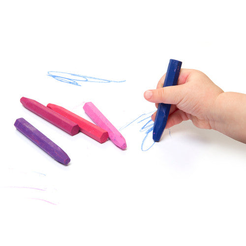 Close-up of hexagonal non-toxic Easi-Grip Oil Pastels individually wrapped in matching colour paper sleeves