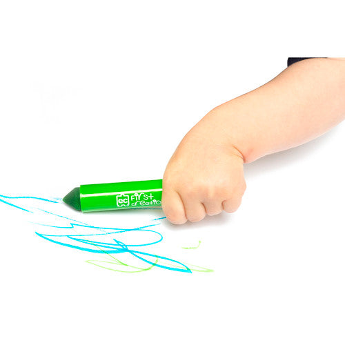 Young child's hand holding a First Creations Maxi Marker for drawing