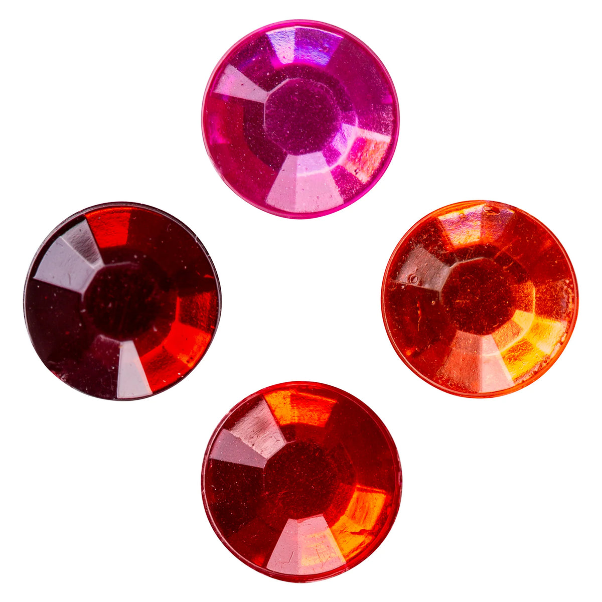 Close up view of four Educational Colours Mixed Adhesive Gems Red on a white background, highlighting the faceted round surfaces and contrasting pink, orange red, bright red and deep ruby tones within the assortment.