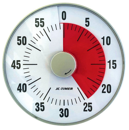 Magnetic countdown timer attached to a whiteboard showing time remaining on red disk