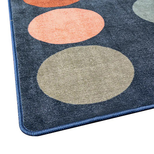 Children seated on the Elizabeth Richards Colours of Australia Circle Rug in a flexible classroom learning environment