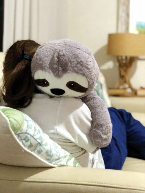 Weighted Sloth packed inside its reusable calico drawstring bag