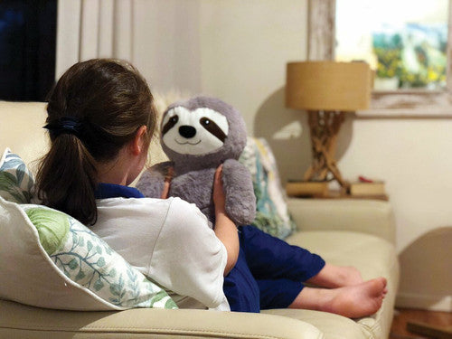 Elizabeth Richards Weighted Soothing Sloth held in two hands to show scale and size