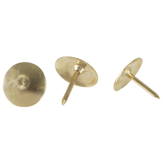 Three brass coloured Esselte drawing pins shown head on, side on and angled with the point visible