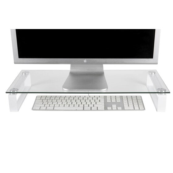 Esselte glass monitor stand holding a desktop monitor with a white keyboard stored in the space underneath