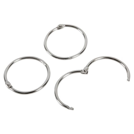Three silver Esselte 38mm hinged rings, two closed and one opened wide on its hinge