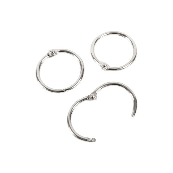Three silver Esselte 25mm hinged rings, two closed and one hinged open