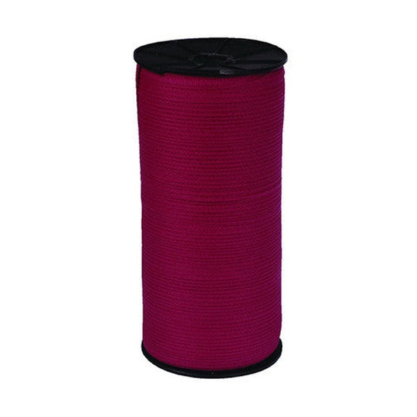 Tall spool of deep pink Esselte legal tape wound on a black plastic reel