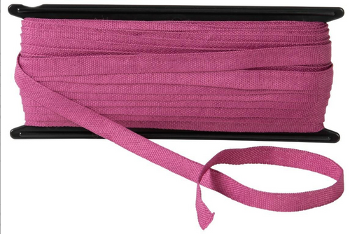 Close-up of pink natural fibre legal tape showing texture and width