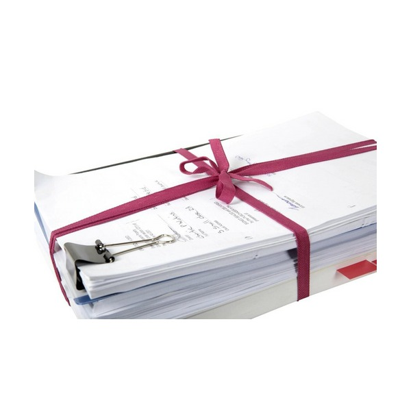 Stack of papers held with a bulldog clip and tied with pink legal tape in a neat bow