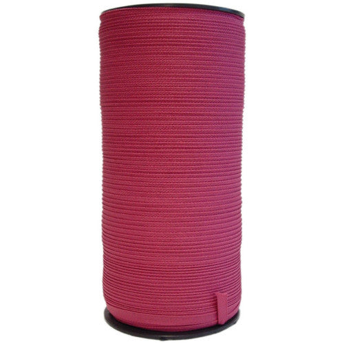 Esselte pink legal tape roll 9mm x 500m on white background