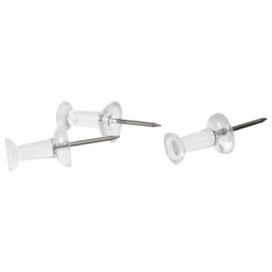 Three clear Esselte push pins with see-through barrel heads and steel points