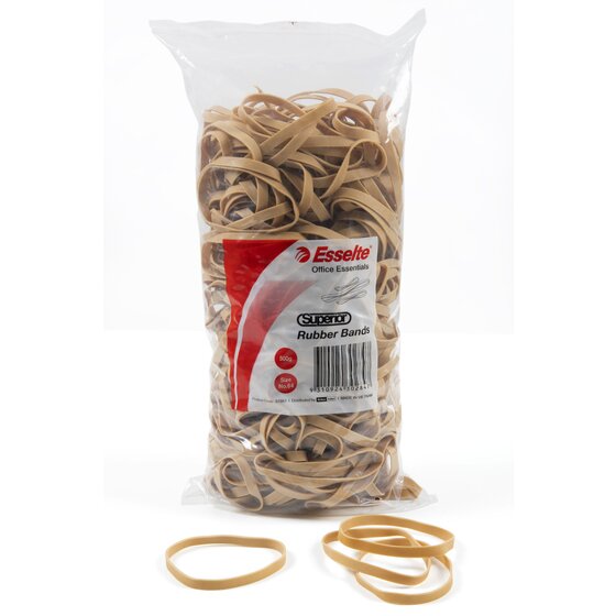 Esselte Superior rubber bands 500g bag standing upright, label reading Size No.64, with loose broad natural bands on the surface in front