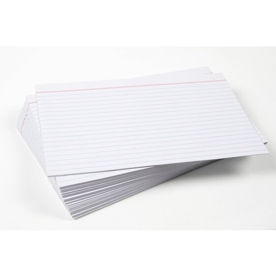 A loose fanned stack of white Esselte ruled system cards showing the red header line and feint blue writing lines