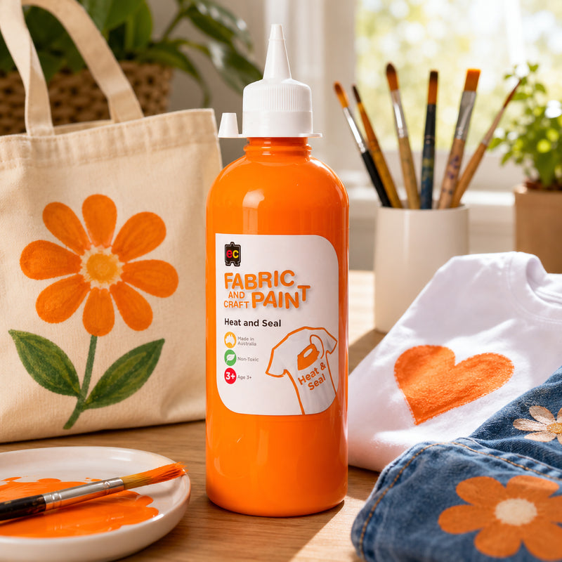 Educational Colours Fabric and Craft Paint 500ml Orange bottle with precision nozzle cap and heat seal label shown against a plain white background.