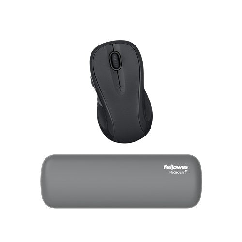 Grey Breyta palm wrist rest lying in front of a dark grey computer mouse, photographed on a white background