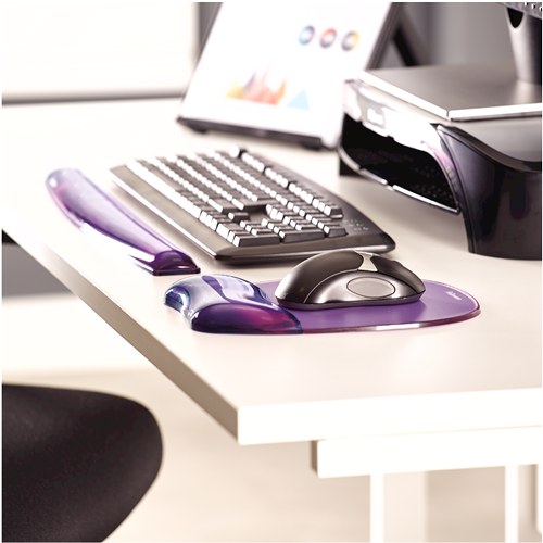 Desk setup with the purple Crystal keyboard rest in front of a keyboard and a purple Crystals gel mouse pad with a mouse