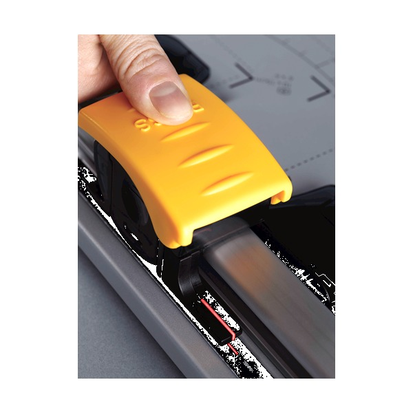 Fingers holding the yellow SafeCut cutting head as it slides along the rail of a Fellowes trimmer