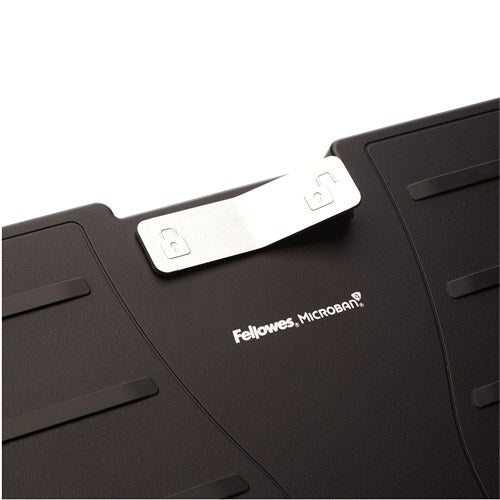 Close-up of the silver control tab on the footrest platform, marked with locked and unlocked padlock symbols