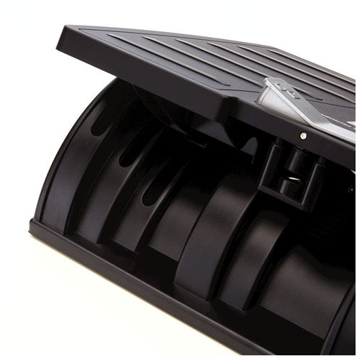 Close-up under the tilted platform showing the curved black base and the ribbed underside of the footrest