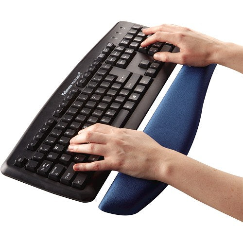 Hands typing on a black keyboard with the wrists resting on the blue PlushTouch foam support