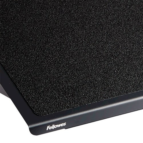 Close-up of the fine grit anti slip surface on the steel platform with the Fellowes logo on the edge