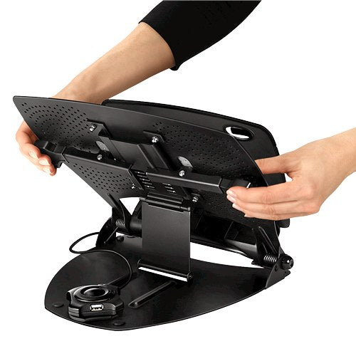 Hands raising the black ventilated platform of the Professional Series laptop workstation to show the support arm