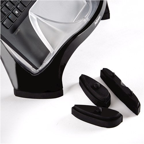 Close-up of the Smart Suites laptop riser edge with three black foot pieces placed beside it