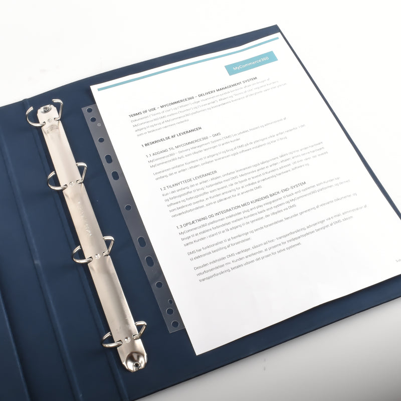 Open navy ring binder with an unpunched printed document held on the rings by a clear 3L filing strip