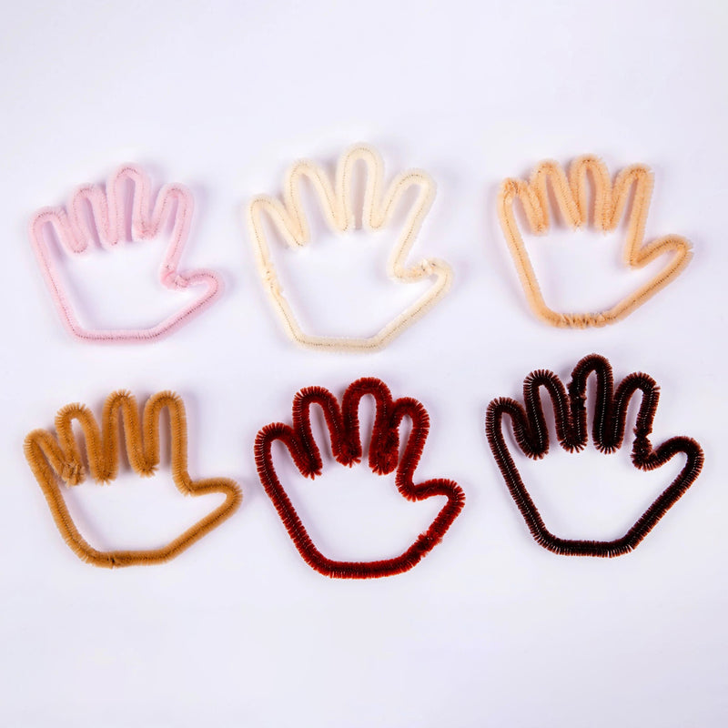 Six hand shaped designs created from individual chenille stems in different skin tone inspired colours. The image demonstrates the flexibility and shaping capability of the stems while highlighting the inclusive colour range available within the set.
