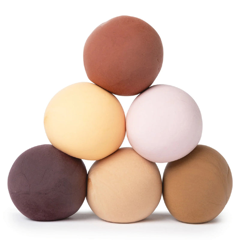 Six clay balls arranged in a pyramid formation displaying the full range of skin tone colours included in the set. The image clearly showcases colour variation and blending possibilities for inclusive creative projects.