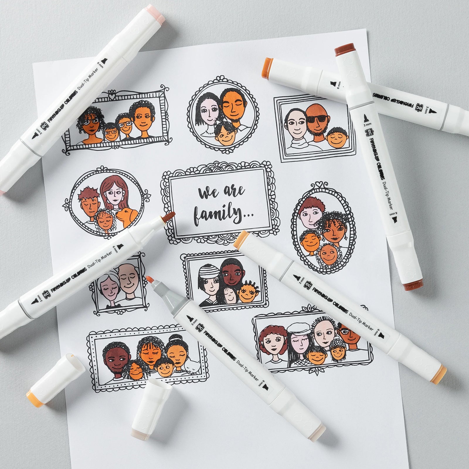 Friendship Colours markers surrounding family themed colouring pages. The image showcases how the skin tone colours can be used to personalise portraits, family projects and cultural learning activities with greater authenticity.