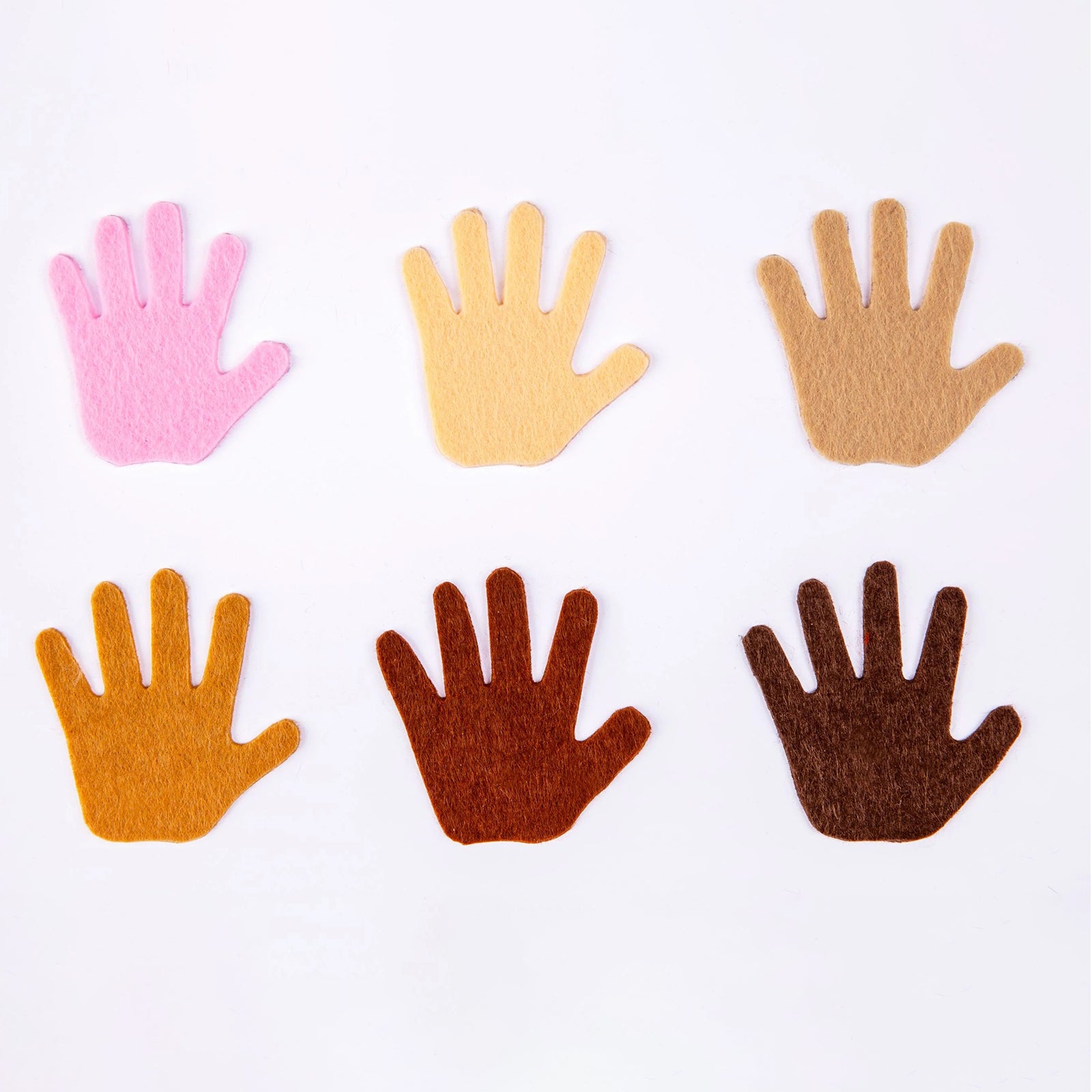 A product showcase displaying six individual felt hand shapes in assorted skin tone colours. The image clearly highlights the colour variety included in the set, making it suitable for multicultural learning activities, identity projects and inclusive classroom resources.