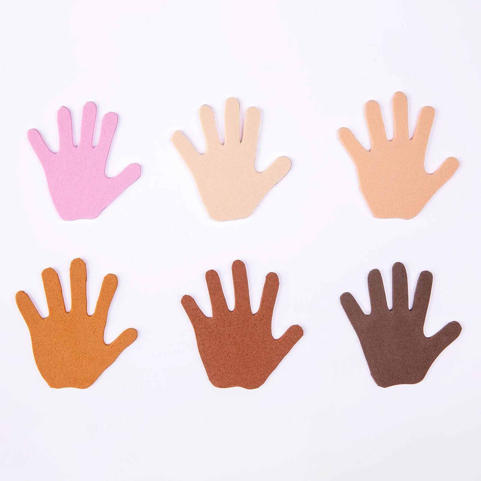 A clean product display showing six hand shaped cut outs made from the assorted foam sheet colours. The arrangement clearly presents the range of skin tone shades included in the pack, making it ideal for educators seeking inclusive craft resources for diverse classroom environments.