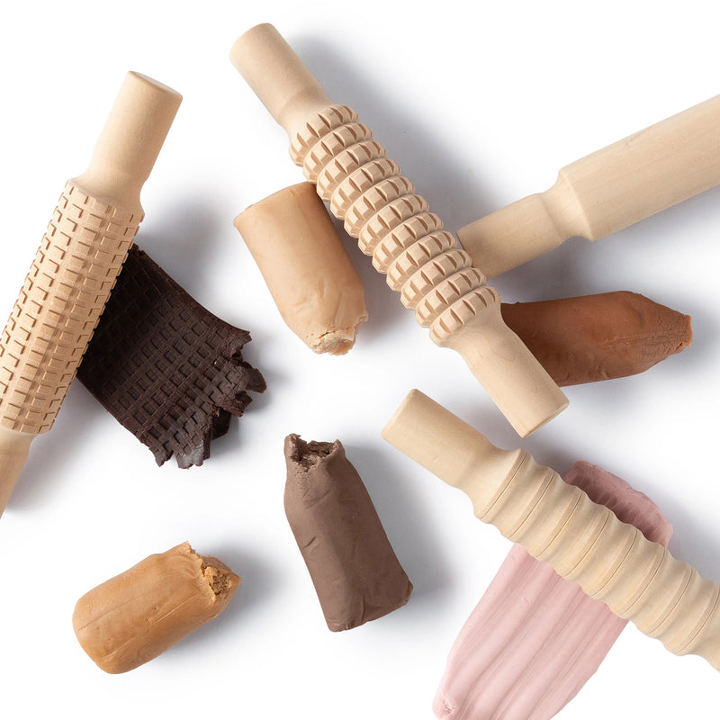 Assorted Friendship Colours Fun Dough pieces paired with wooden texture rollers. The image demonstrates the dough's pliable consistency and suitability for creating patterns, textures and sensory exploration activities.
