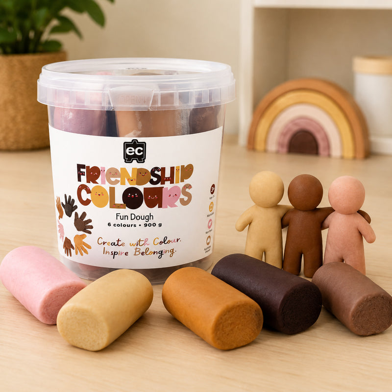 Friendship Colours Fun Dough storage tub displayed alongside completed character models and individual dough pieces. The arrangement showcases the six inclusive colours and demonstrates how children can create people, families and community themed projects.