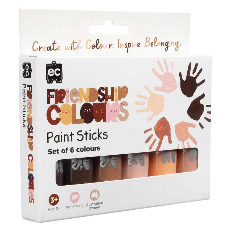 Angled packaging presentation displaying the Friendship Colours Paint Sticks set with visible colour assortment and inclusive handprint graphics. The packaging communicates creativity, belonging and diversity through an attractive educational design.