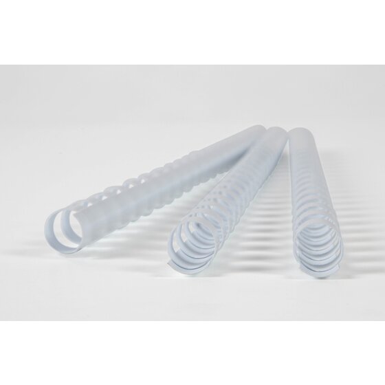 Three white GBC plastic binding combs lying on a pale grey surface with their curled ends towards the camera