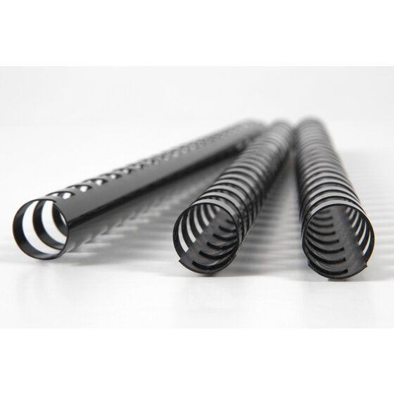 Three black GBC plastic combs resting on a white surface with the rings of the front comb facing the camera