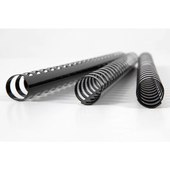 Close view of three black GBC plastic combs lying on a pale surface, open ends showing the curved rings