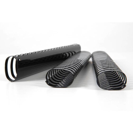 Three large black GBC plastic binding combs on a white surface, the open curled ring ends facing forward