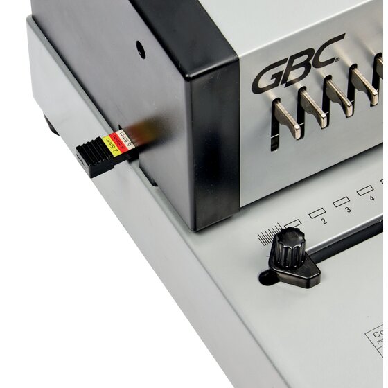 Close view of the GBC CombBind CB25E Pro margin selector marked 2.5mm, 4.5mm and 6.5mm beside the numbered hole guides