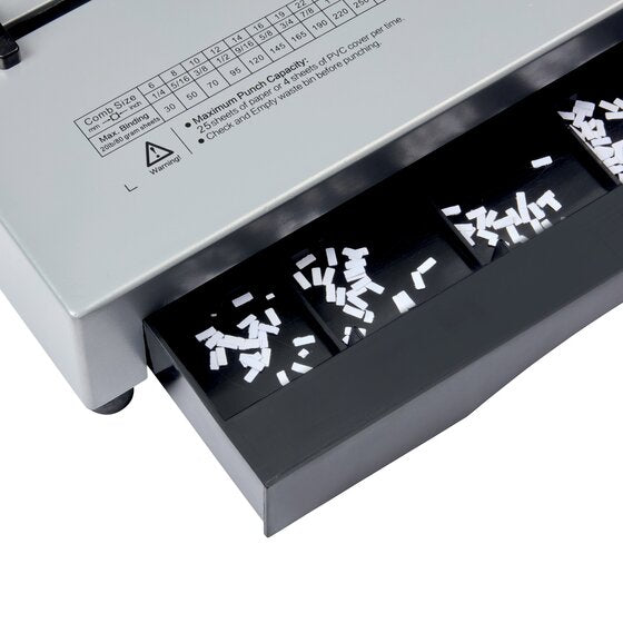 Clippings drawer pulled from the GBC CombBind CB25 Pro beneath the printed comb chart and punch capacity label