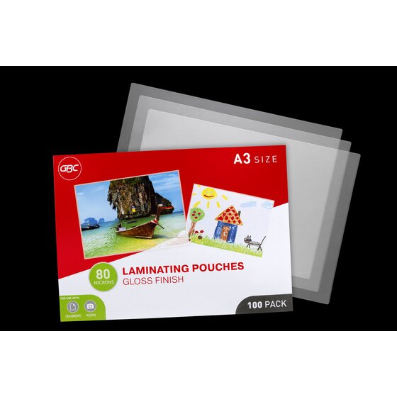GBC A3 size 80 micron gloss laminating pouches box lying in front of three loose clear pouches on a black background