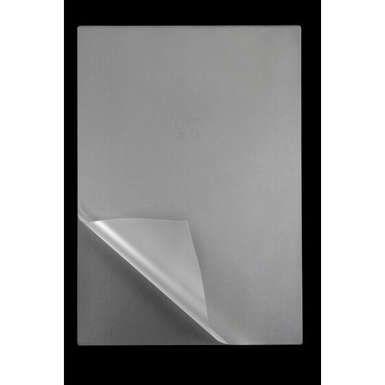 Single clear GBC A3 laminating pouch on black with its lower left corner curled back to show the open edge